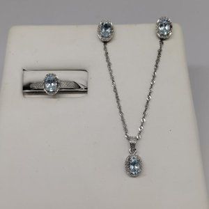 Swiss Blue Topaz Jewlery set sterling silver white gold plated.
